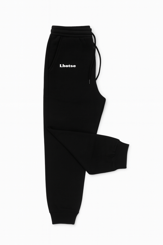 Black sweatpants with a brand logo on a white background